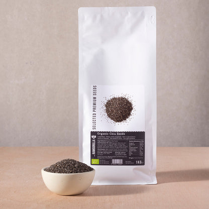 Organic chia seeds in a clear bag from RAWGORILLA, displayed on a white background, showing small black and white seeds.