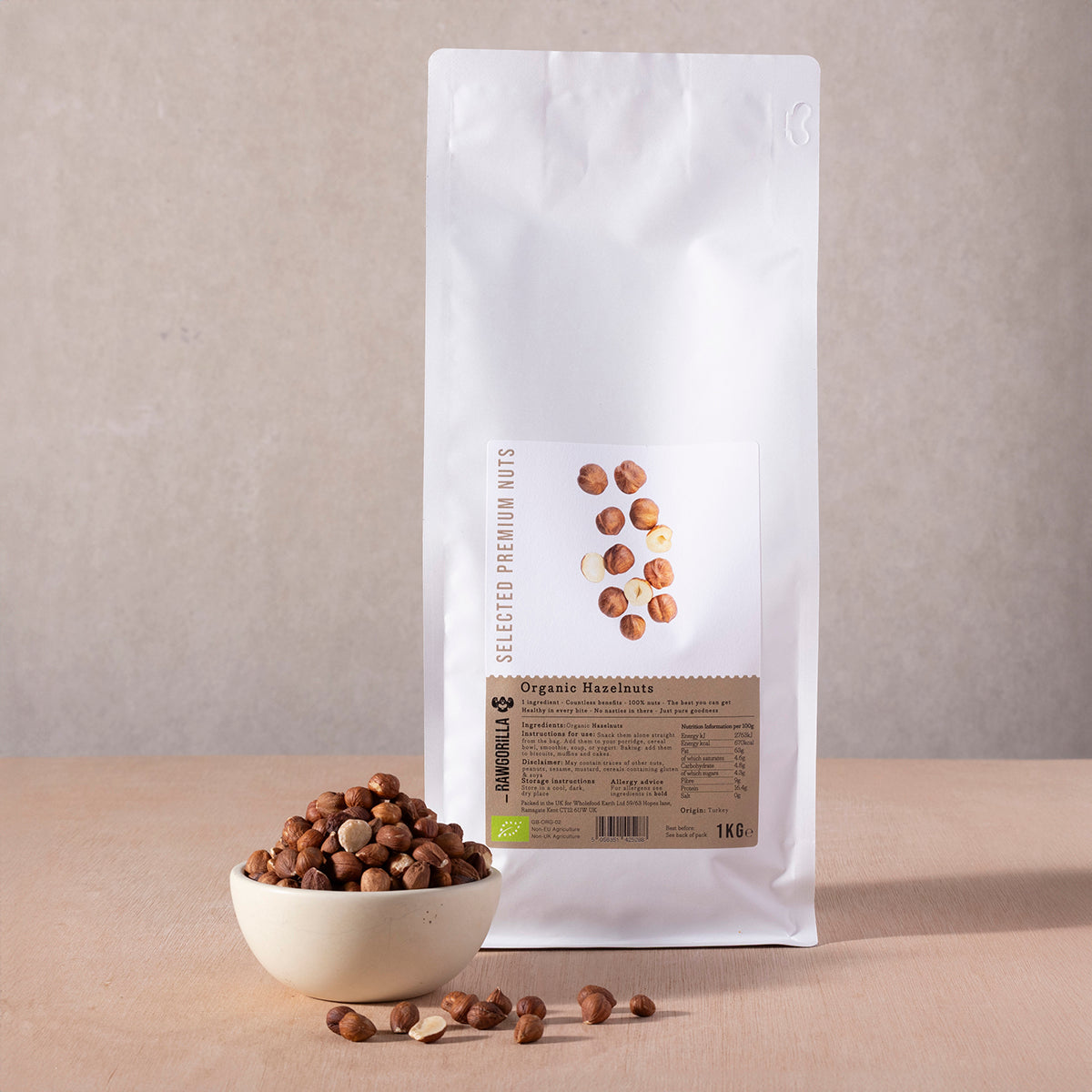 Organic hazelnuts from RAWGORILLA in a 1kg bag, displayed in a close-up image, showcasing their brown, textured shells.