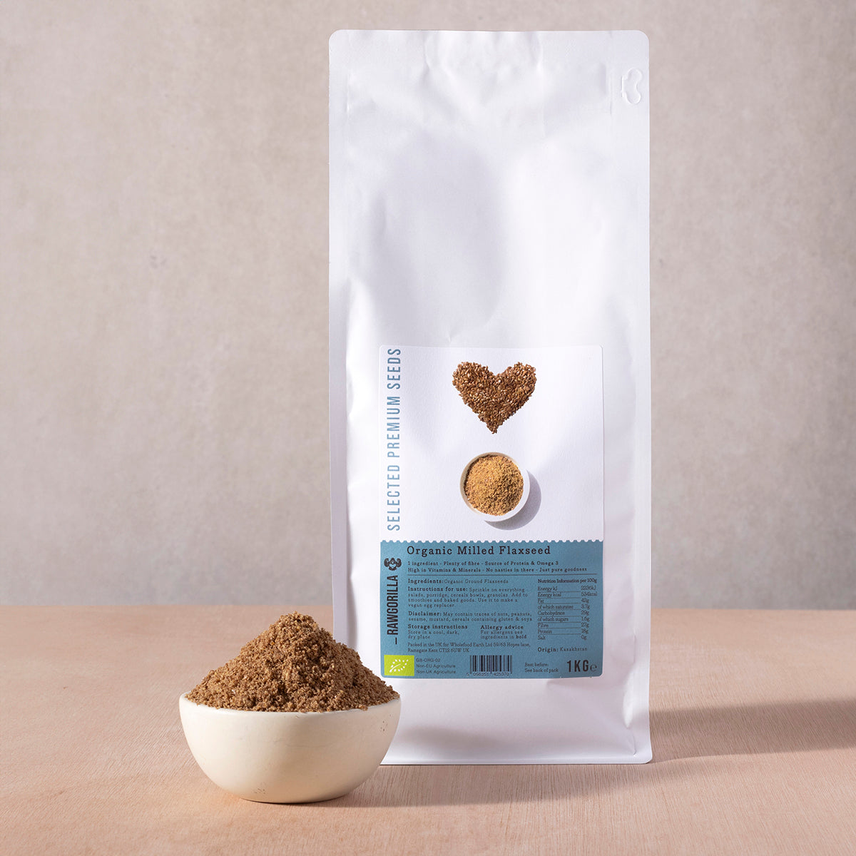 Organic Milled Flaxseeds from RAWGORILLA, 1kg pack, showing golden ground flaxseeds in a clear container, part of Whole Food Earth nuts and seeds.