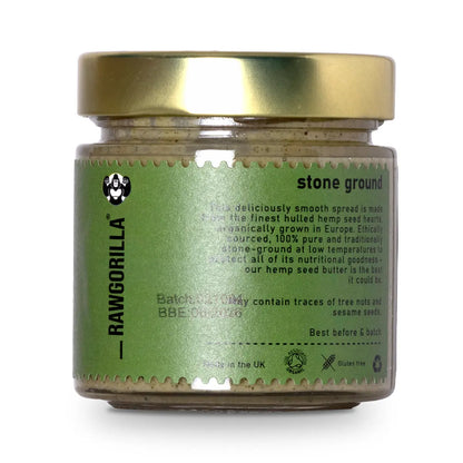 Creamy raw organic hemp seed butter by RAWGORILLA, perfect for dips and spreads, displayed in a jar with hemp seeds around it.