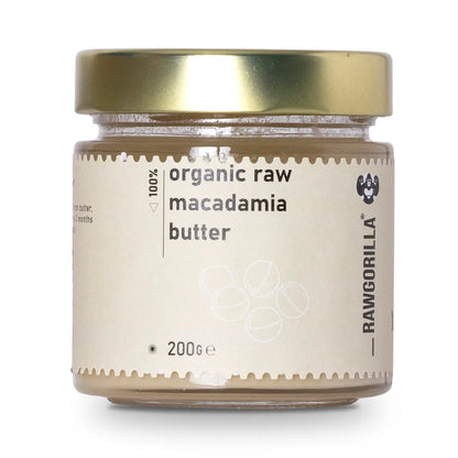 Creamy organic raw macadamia nut butter from RAWGORILLA, in a jar, showcasing smooth texture and natural nut appearance.