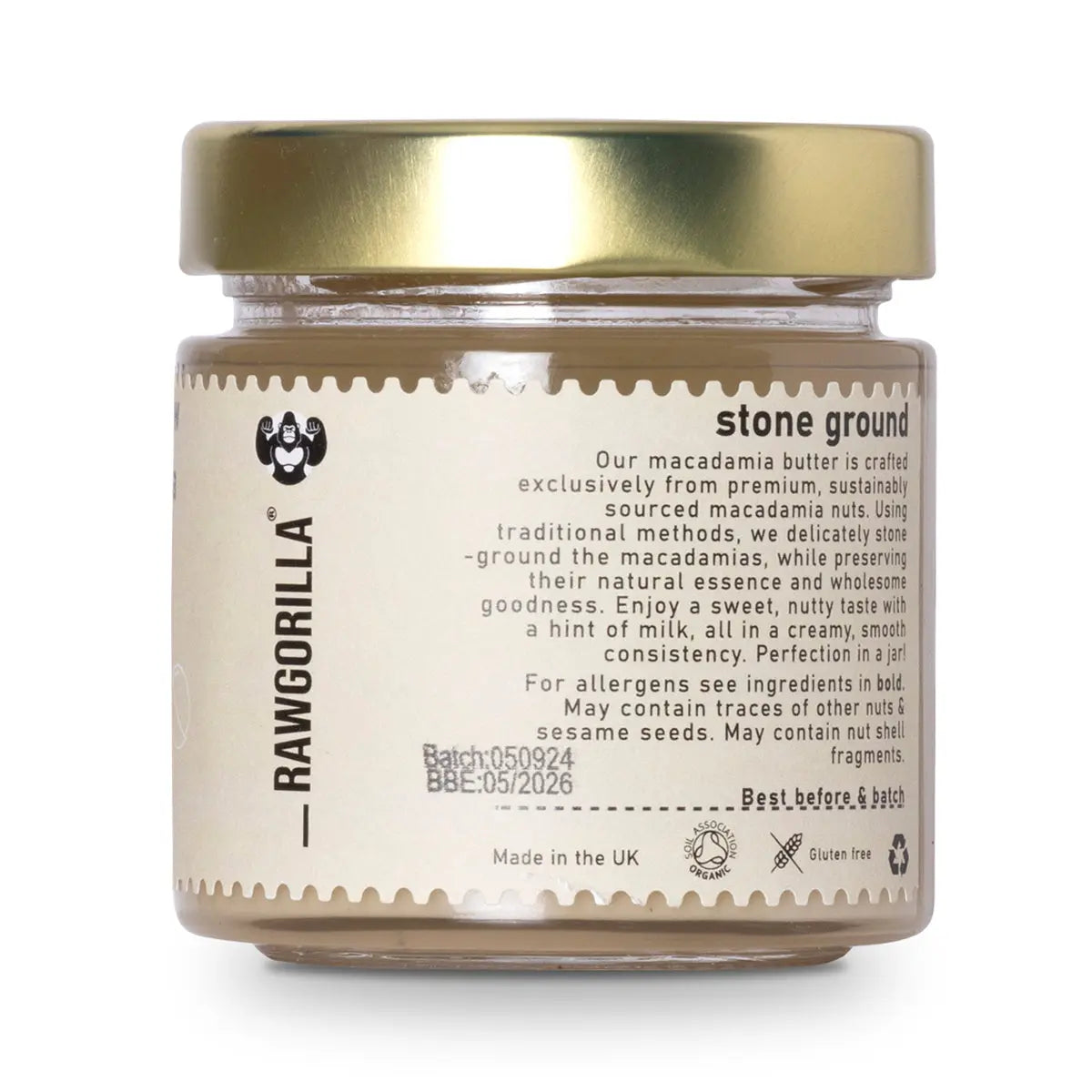 Organic raw macadamia butter from RAWGORILLA in a jar, showcasing a creamy, light-colored nut butter on a wooden surface.