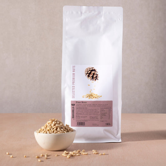Raw pine nuts from RAWGORILLA, 1kg package, natural nuts and seeds by Whole Food Earth, shown in a clear view.