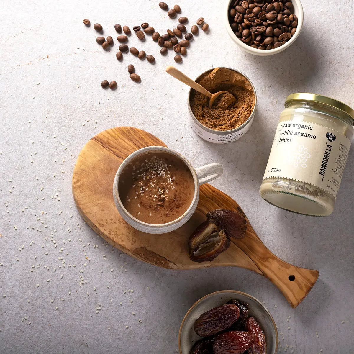 Creamy white sesame tahini dip from RAWGORILLA by Whole Food Earth, showcasing a jar of smooth, organic sesame spread.