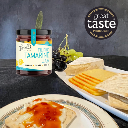 Filipino tamarind jam by RoniBs Kitchen, perfect with cheese, showcasing a jar with tamarind and cheese slices on a plate.