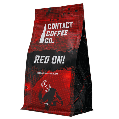 Red On! high-caffeine coffee by Contact Coffee Company Ltd. in a sleek red coffee bag with bold branding.