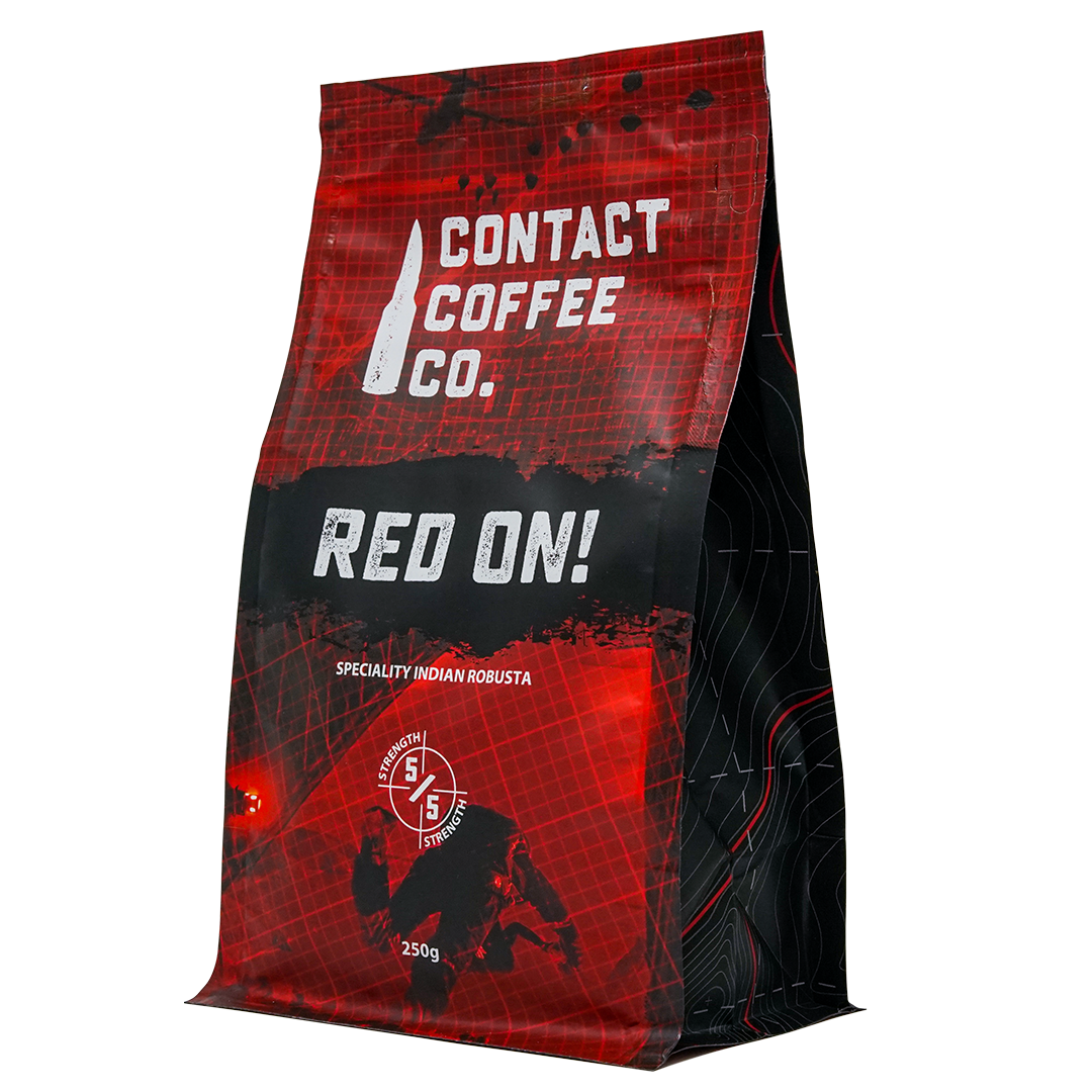 Assorted coffee beans and packaging from Contact Coffee Company Ltd. for coffee resupply deals, displayed in a natural setting.