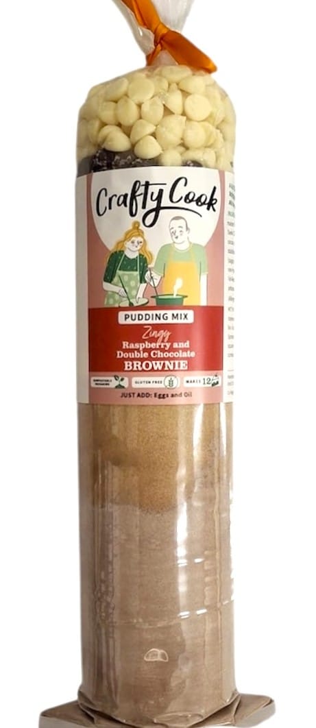 Gluten-free raspberry and double chocolate brownie mix by Crafty Cook shown in a box with mix ingredients.