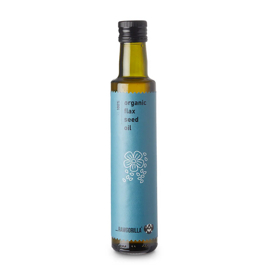 Cold pressed organic flaxseed oil in a 250ml glass bottle, showcasing the label and golden oil inside.