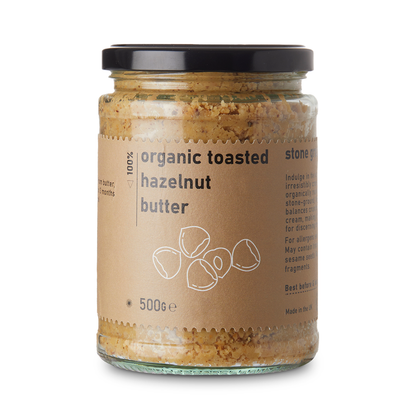 Organic toasted hazelnut butter in a jar from RawGorilla, showing creamy texture and label on the nut butter container.
