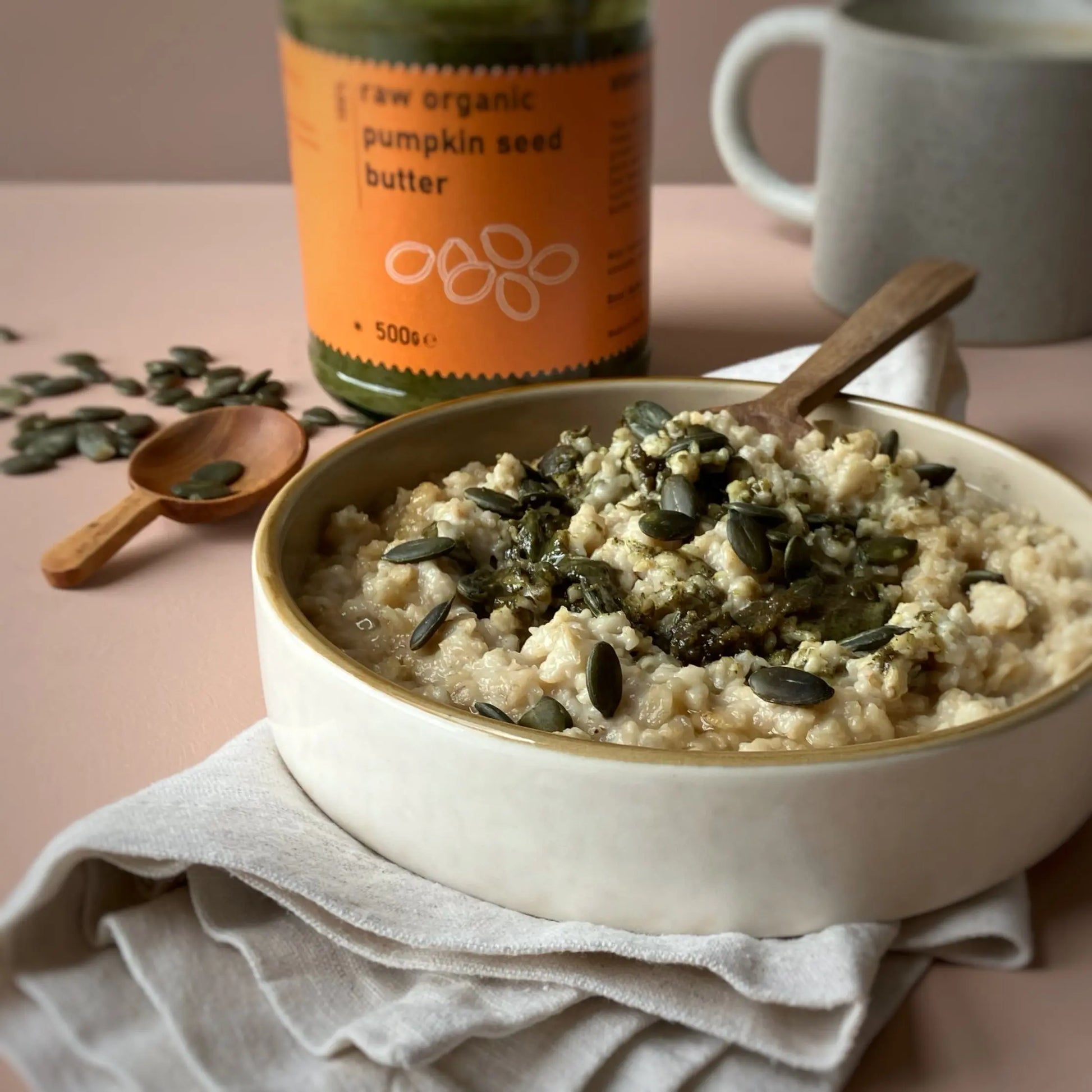 Creamy raw organic pumpkin seed butter from RawGorilla, a natural dip and spread by Whole Food Earth, shown in a jar.
