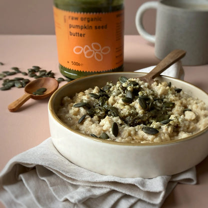 Creamy raw organic pumpkin seed butter from RawGorilla, a natural dip and spread by Whole Food Earth, shown in a jar.