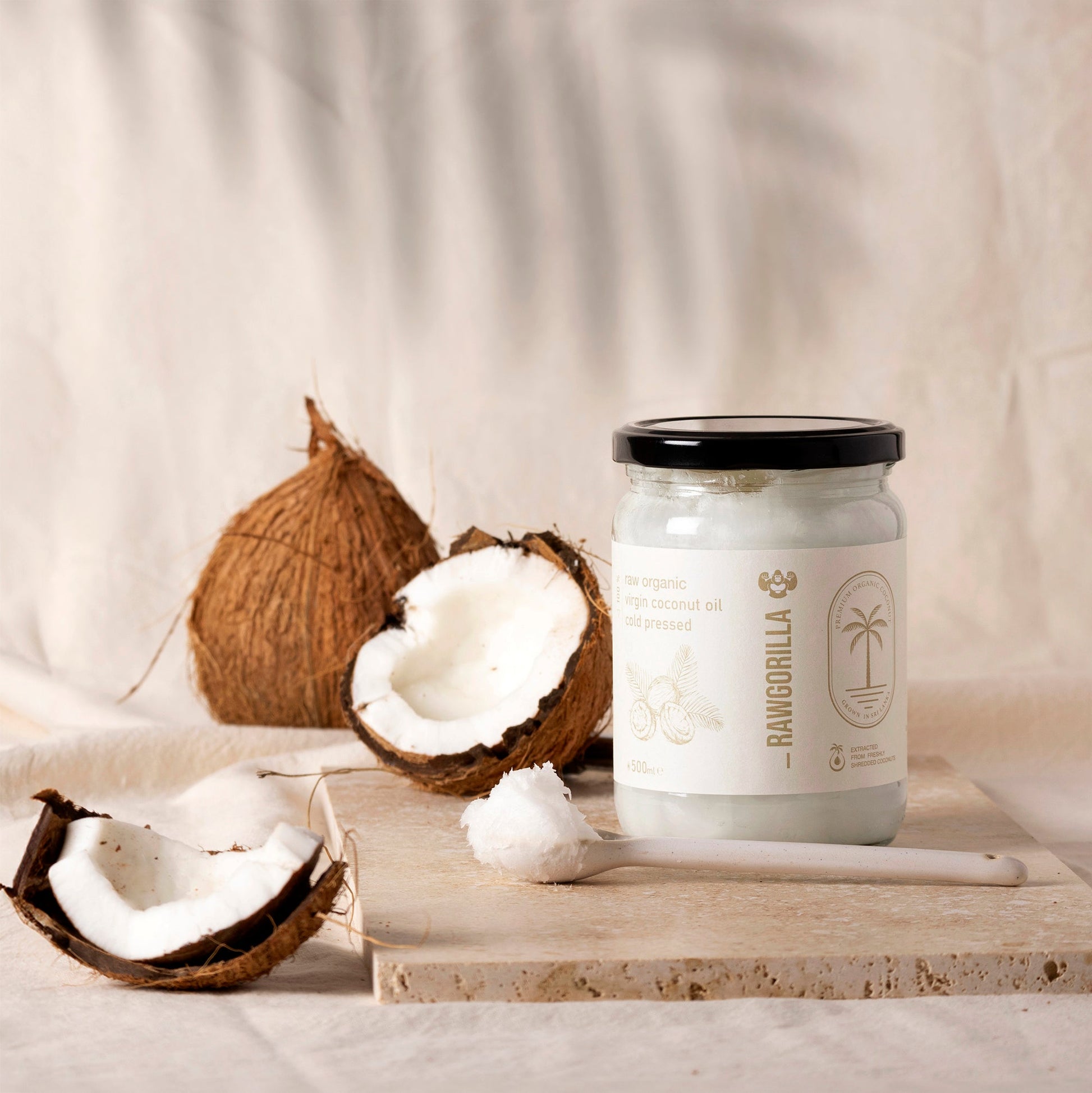 Raw organic virgin coconut oil in a 500ml jar from Whole Food Earth, suitable for cooking and skincare.