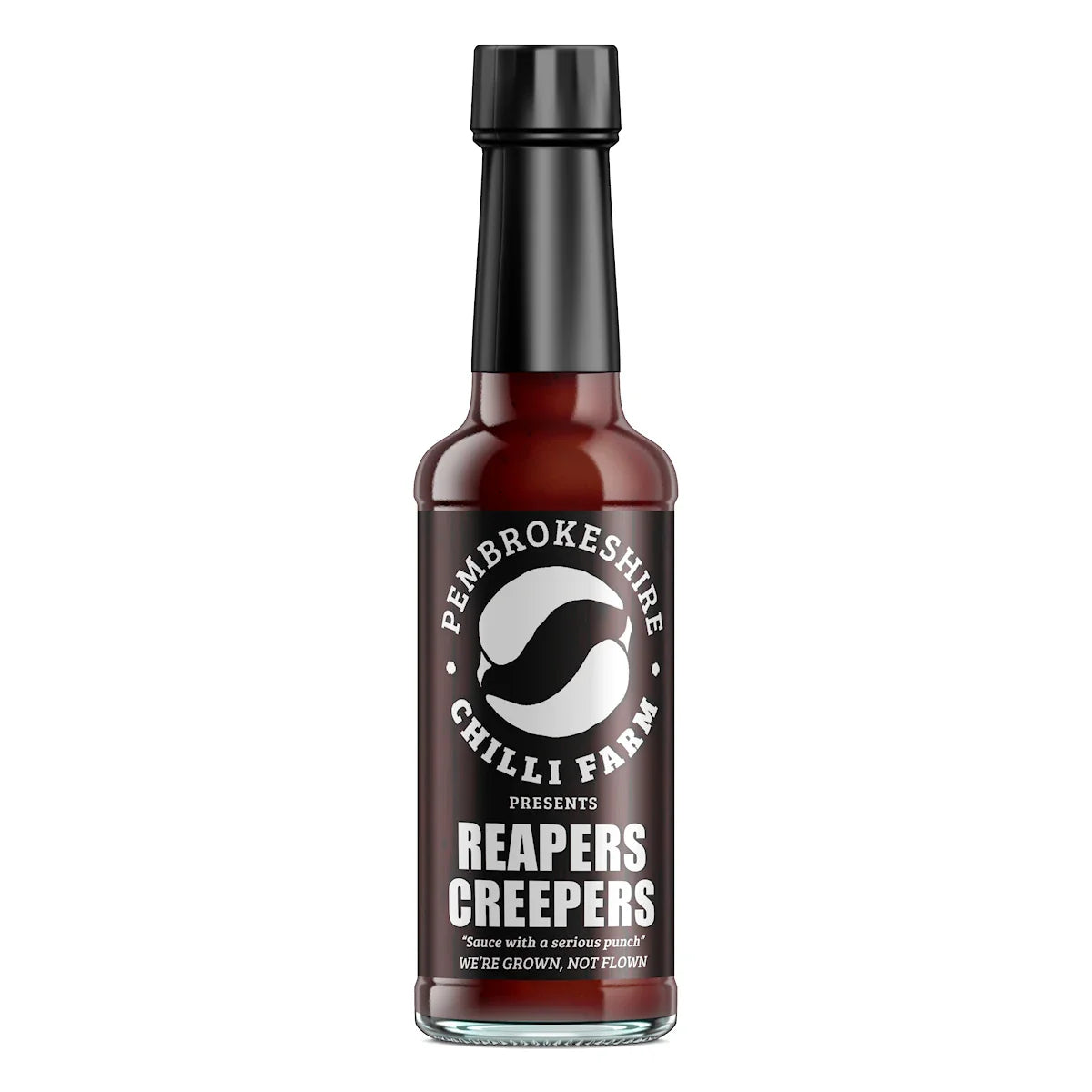 Reapers Creepers hot chilli sauce bottle from Pembrokeshire Chilli Farm with label and vibrant red sauce in clear glass bottle.