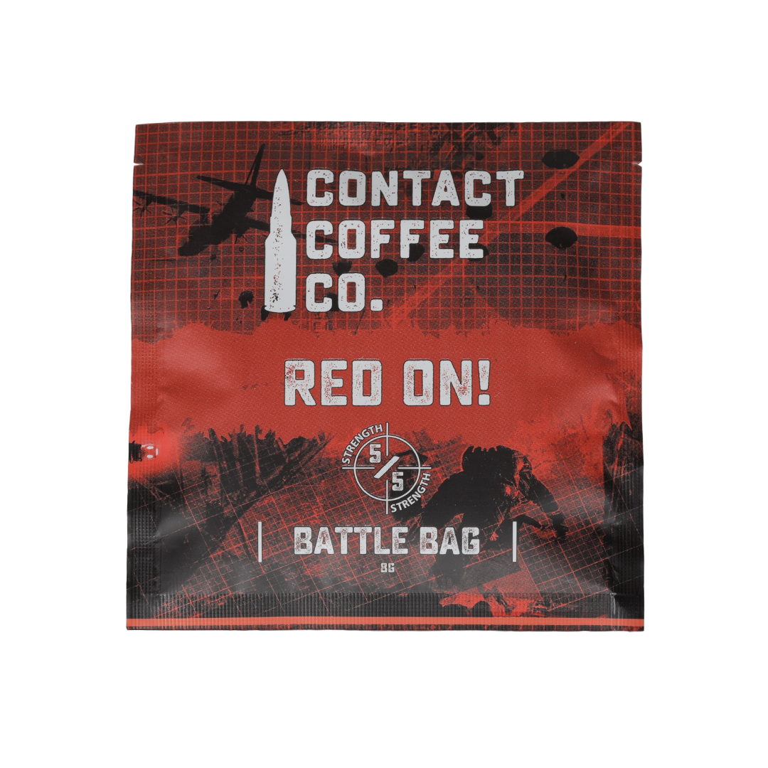 Red single serve coffee brew bag from Contact Coffee Company Ltd. ready for brewing, featuring vibrant red packaging.