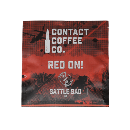 Red single serve coffee brew bag from Contact Coffee Company Ltd. ready for brewing, featuring vibrant red packaging.