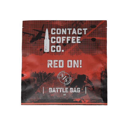 Red single serve coffee brew bag from Contact Coffee Company Ltd. ready for brewing, featuring vibrant red packaging.