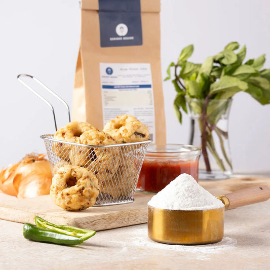 Whole Food Earth rice flour 100% from Serious Grains in a kitchen setting, displayed in a clear container with baking ingredients.