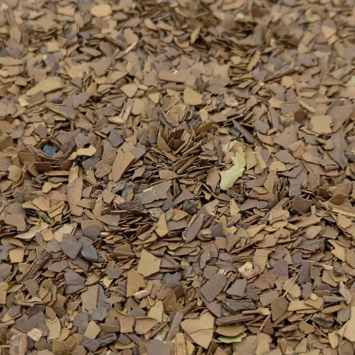 Loose roasted yerba mate herbal tea leaves from Porter Hill Tea Company, showing dark, dried leaf fragments.