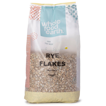 Whole Food Earth rye flakes in a 1kg bag, specialty cereal flakes with a textured appearance and natural rye grain color.