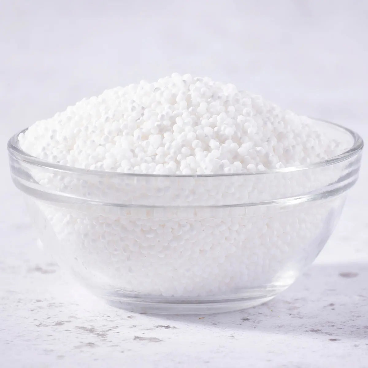 Whole Food Earth sago pearls, small translucent grains used as a gluten-free flour and cooking ingredient in various dishes.