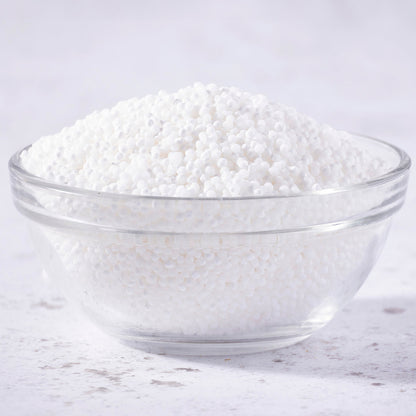 Whole Food Earth sago pearls, small translucent tapioca-like grains used in cooking and baking, displayed in a close-up image.