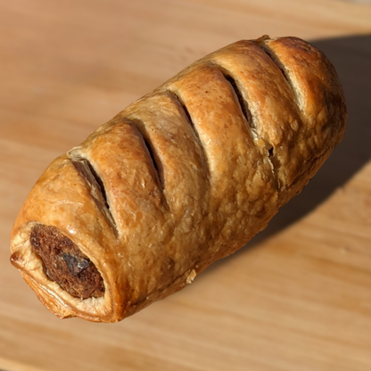 Sausage roll made with Bangin' Sausage Mix by Another Way, showcasing a golden-brown pastry filled with seasoned sausage.