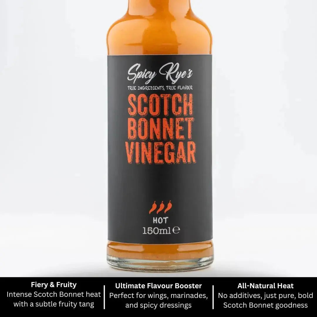 Spicy Ryes Scotch Bonnet Vinegar bottle with a label featuring red and yellow design, placed on a wooden surface.