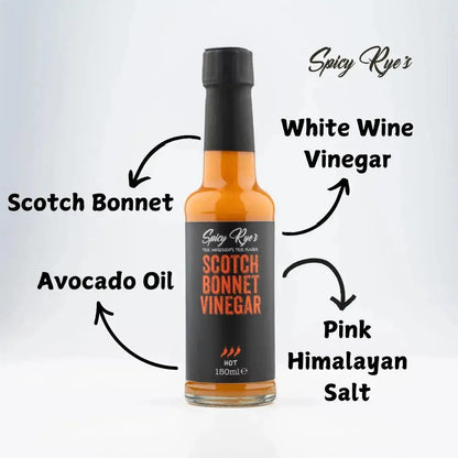 Bottle of Spicy Ryes Scotch Bonnet Vinegar with a clear label, showcasing the spicy vinegar product on a wooden surface.