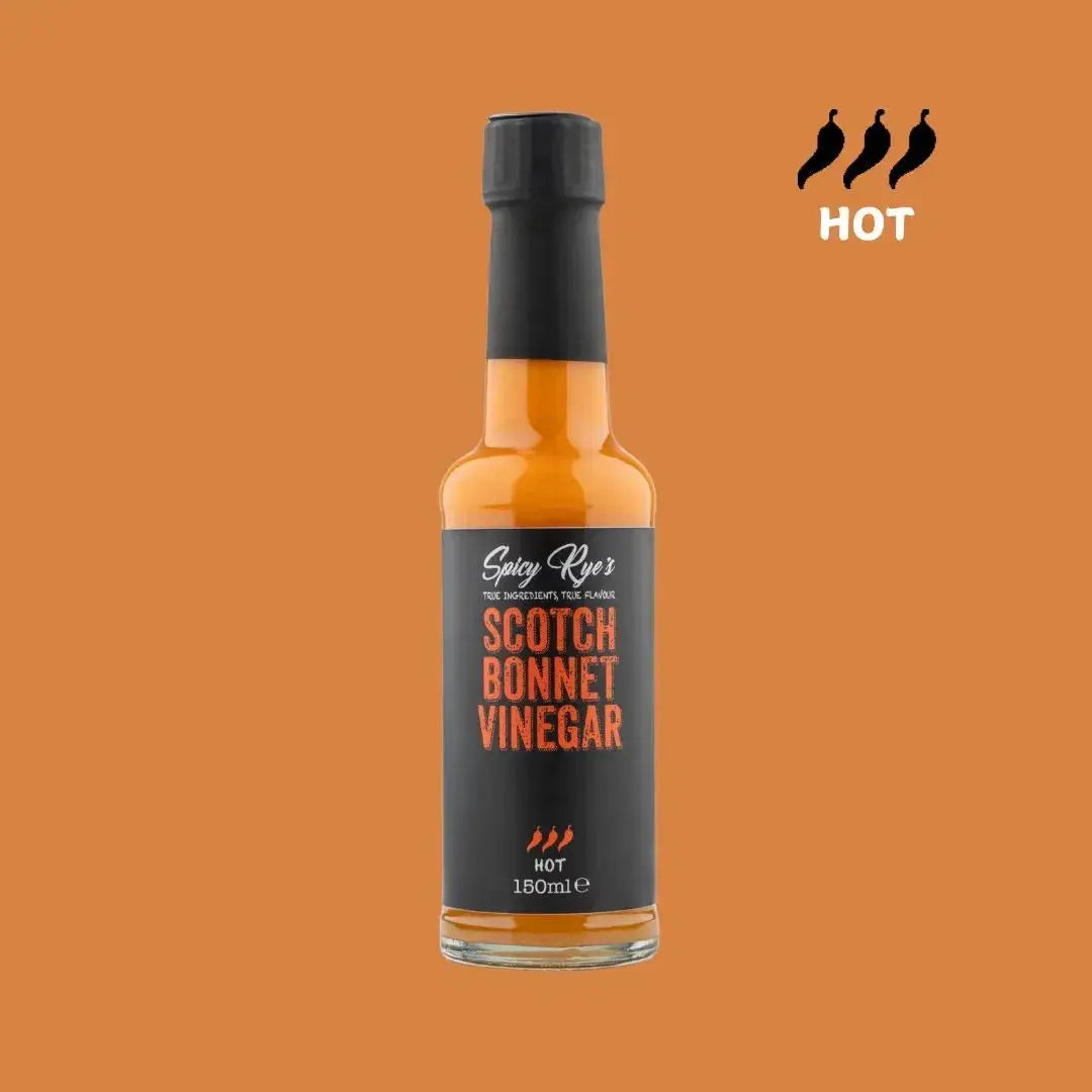 Spicy Ryes Scotch Bonnet Vinegar bottle with bright label and clear glass showing the fiery red-colored vinegar inside.