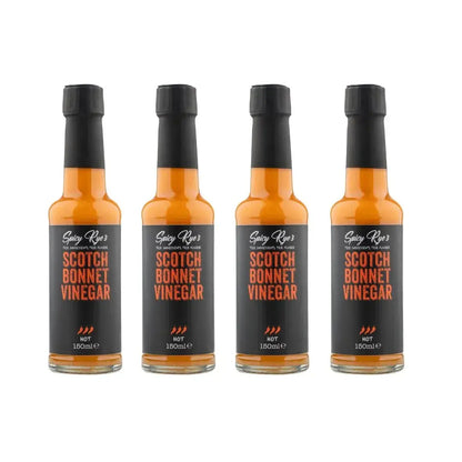 Spicy Ryes Scotch Bonnet Vinegar bottles, bright yellow and red labels, showing four 710ml bottles of hot pepper vinegar.
