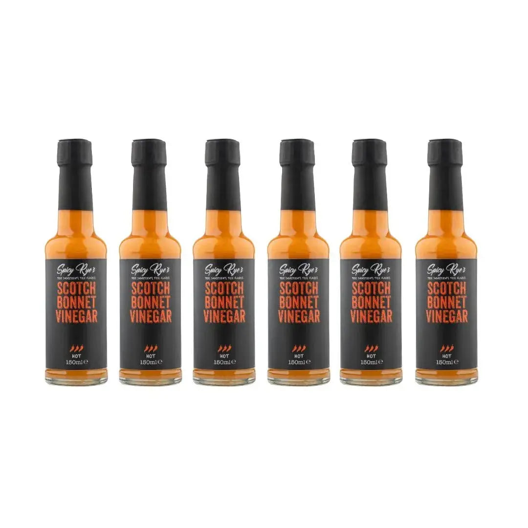 Six bottles of Spicy Ryes Scotch Bonnet Vinegar with red caps and label, arranged in a row on a white background.