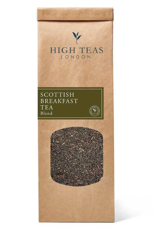 Loose leaf Scottish Breakfast Tea by High Teas, showcasing golden-brown tea leaves in a clear jar.