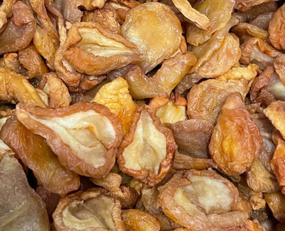 Dried pear halves from Whole Food Earth, showing golden, sliced dried fruits on a neutral background.