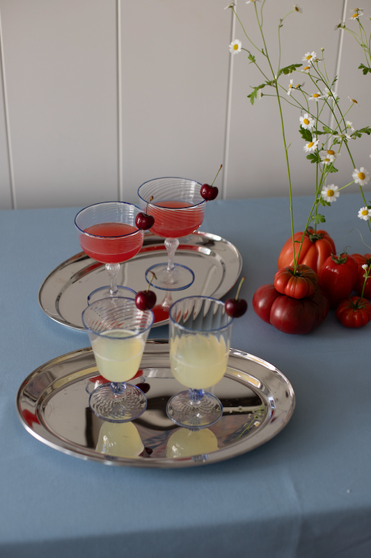Set of two blue Venetian wine glasses by domenicamarland, featuring elegant, transparent glass with intricate design details.