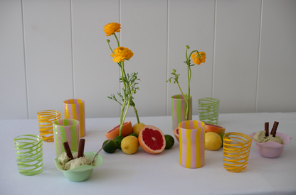 Set of four green Kiki tumblers by domenicamarland, showcasing sleek glass design with vibrant green color.