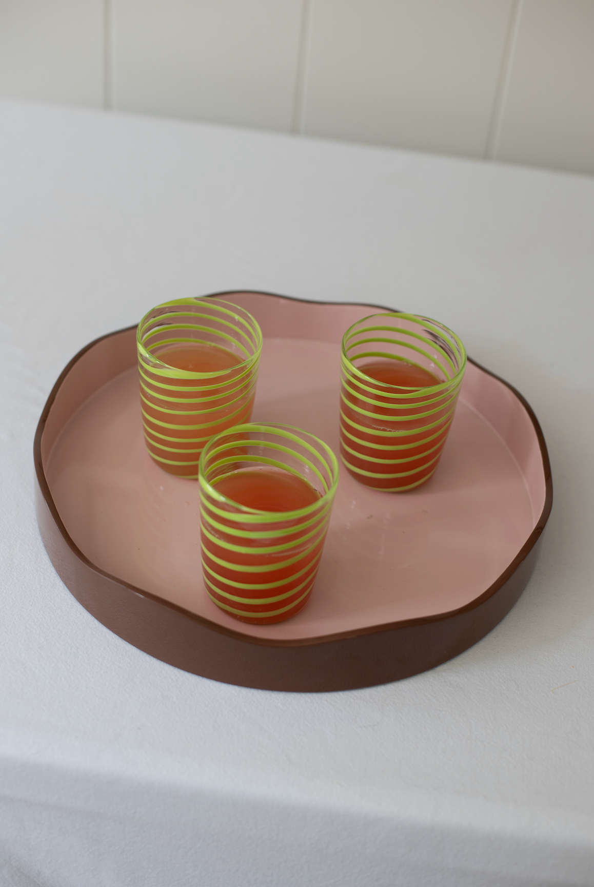 Set of four green Kiki tumblers by domenicamarland, cylindrical glass drinkware with a smooth finish.