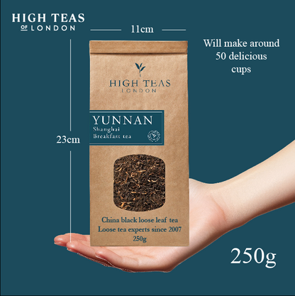 Loose leaf Yunnan Imperial "Gold Tip" Shanghai Breakfast Tea from High Teas, showing golden-tipped tea leaves in a clear container.
