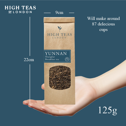 High Teas Yunnan Imperial "Gold Tip" loose leaf Shanghai Breakfast Tea, golden-tipped dark tea leaves in a clear jar.