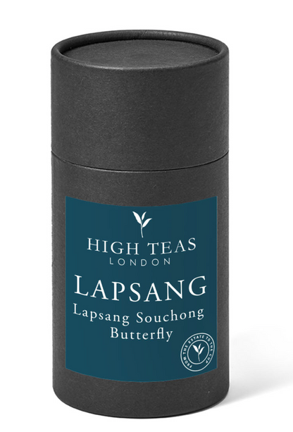 Loose leaf Lapsang Souchong Butterfly tea by High Teas, showing dark, twisted tea leaves in a clear glass jar.