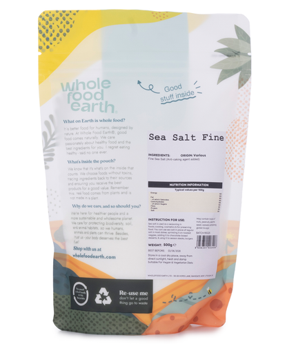Fine sea salt from Whole Food Earth, mineral-rich natural salt in a 500g container, with coarse grains and white crystalline appearance.