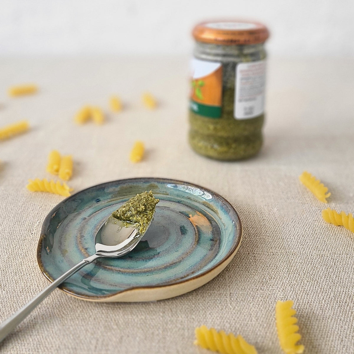 Seafoam blue classic spoon rest by Katie L Thompson Designs, featuring a smooth ceramic surface and curved design for kitchen use.