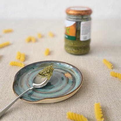 Seafoam blue classic spoon rest by Katie L Thompson Designs, featuring a smooth ceramic surface and curved design for kitchen use.