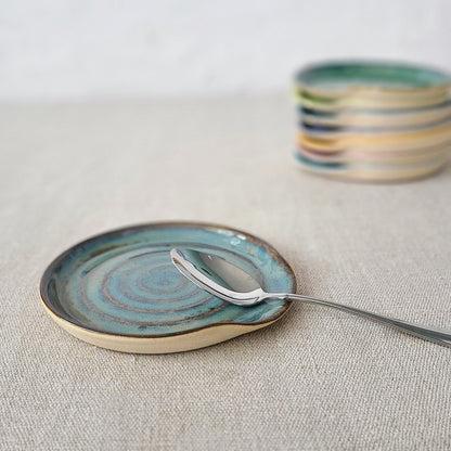 Seafoam blue ceramic spoon rest with a classic design by Katie L Thompson Designs, perfect for kitchen and cooking use.