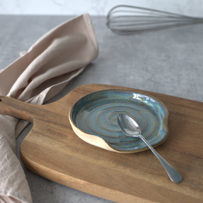 Seafoam blue ceramic spoon rest by Katie L Thompson Designs, featuring a classic, elegant shape for kitchen use.