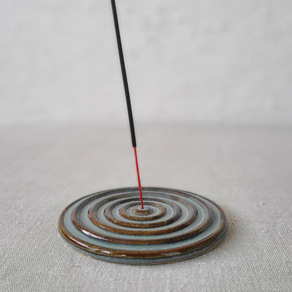 Seafoam blue ceramic incense burner with a classic design by Katie L Thompson Designs, featuring a rounded shape and decorative openings.