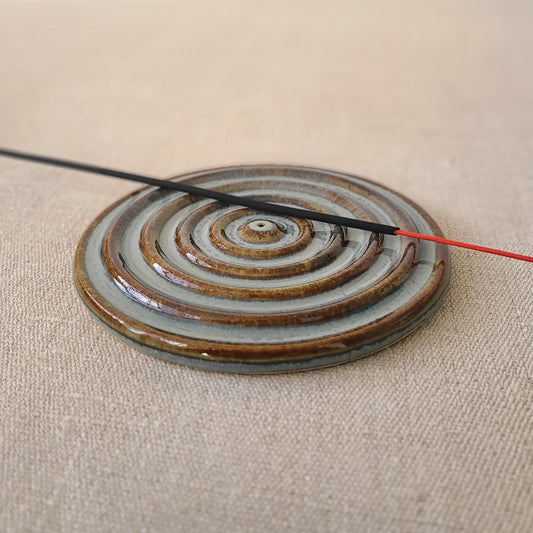 Seafoam blue incense burner with a circular design and a stick holder, crafted by Katie L Thompson Designs.