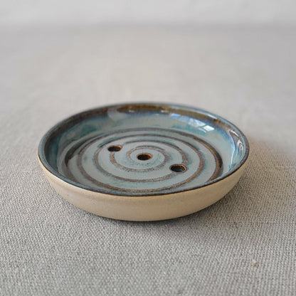 Seafoam blue ceramic soap dish from Katie L Thompson Designs with a simple, elegant design for holding soap.