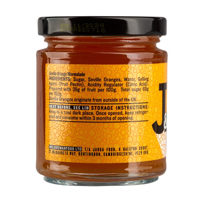 Janda Seville Orange Marmalade jar with a spread of orange marmalade on toast, showcasing the bright orange color and textured surface.