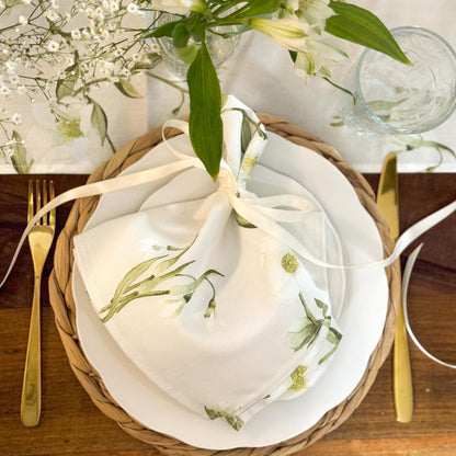 Elegant table runner featuring snowdrop and hellebore floral patterns by Avalon Home UK, perfect for spring decor.